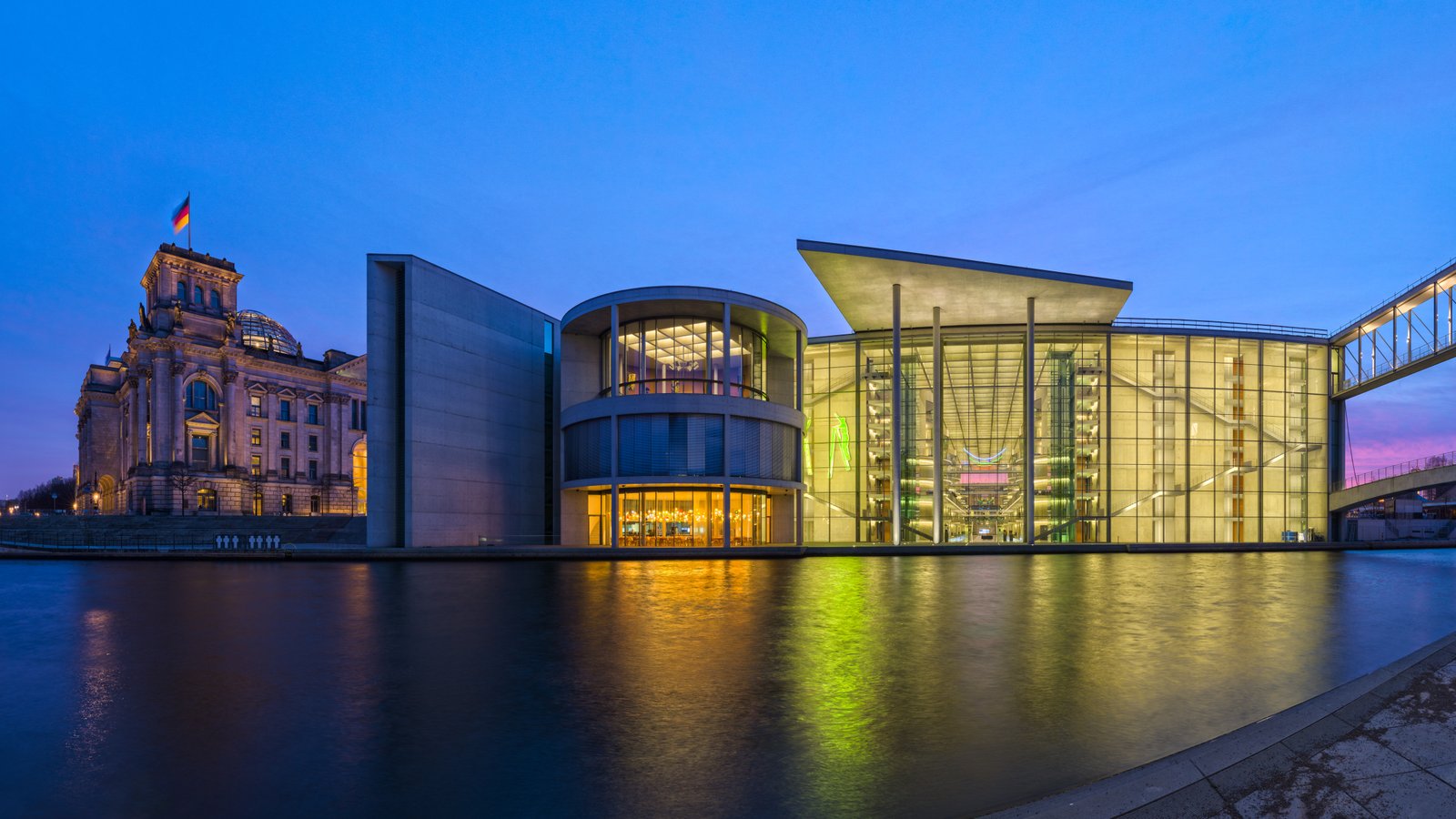 The east side of the Paul-Löbe-Haus in Berlin-Mitte, facing the river Spree, during the blue hour. On the left the Reichstag building can be seen. The Paul Löbe building was built according to plans of architect Stephan Braunfels.